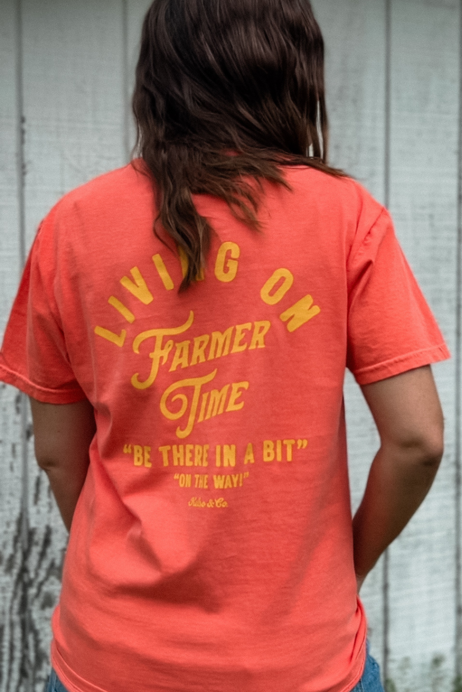 Living On Farmer Time Graphic Tee in Bright Coral - Rosebud's Tees