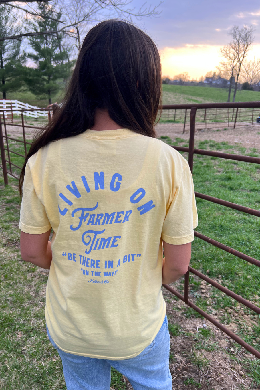 Butter yellow unisex t shirt with blue lettering.