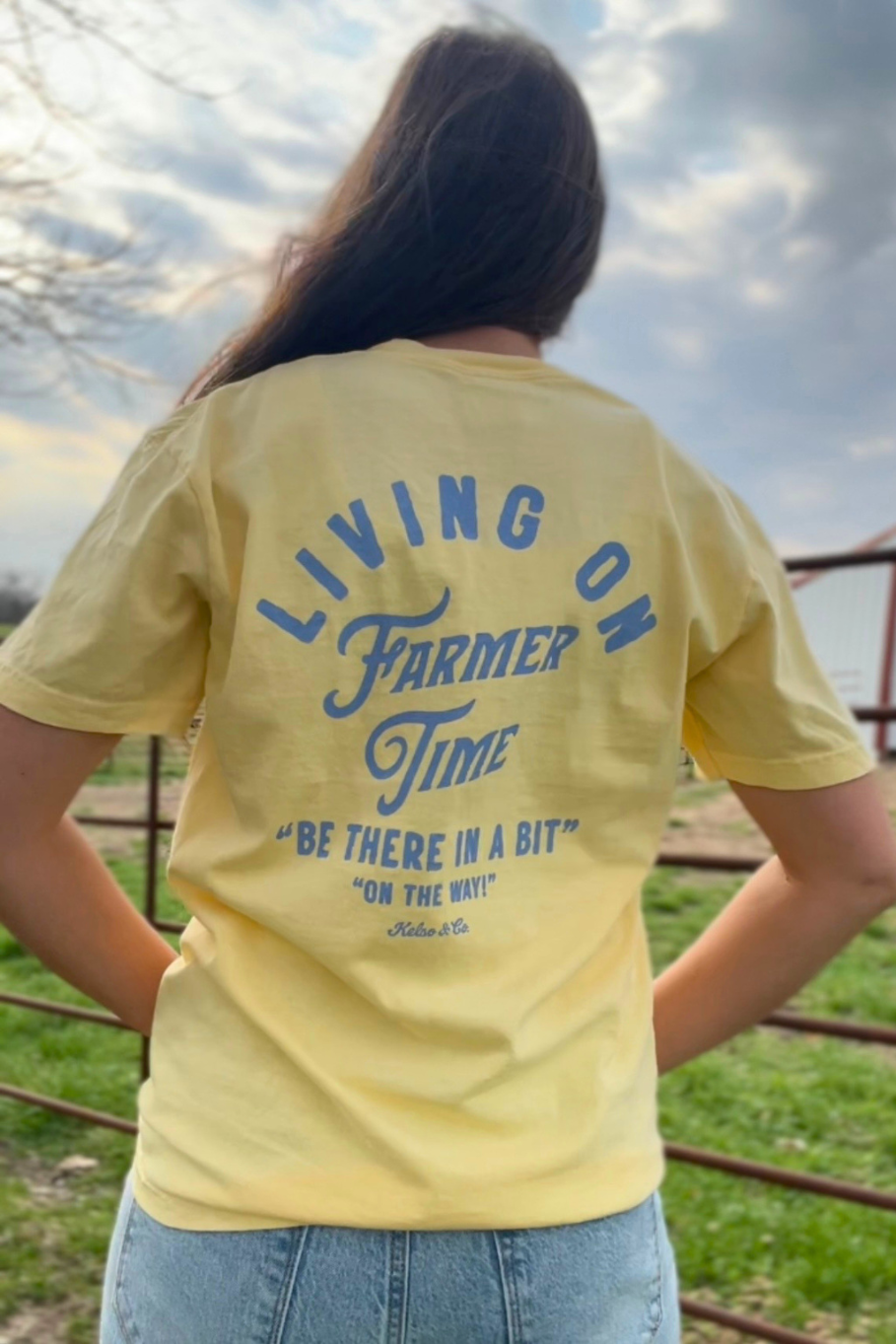 Butter yellow unisex t shirt with blue lettering.