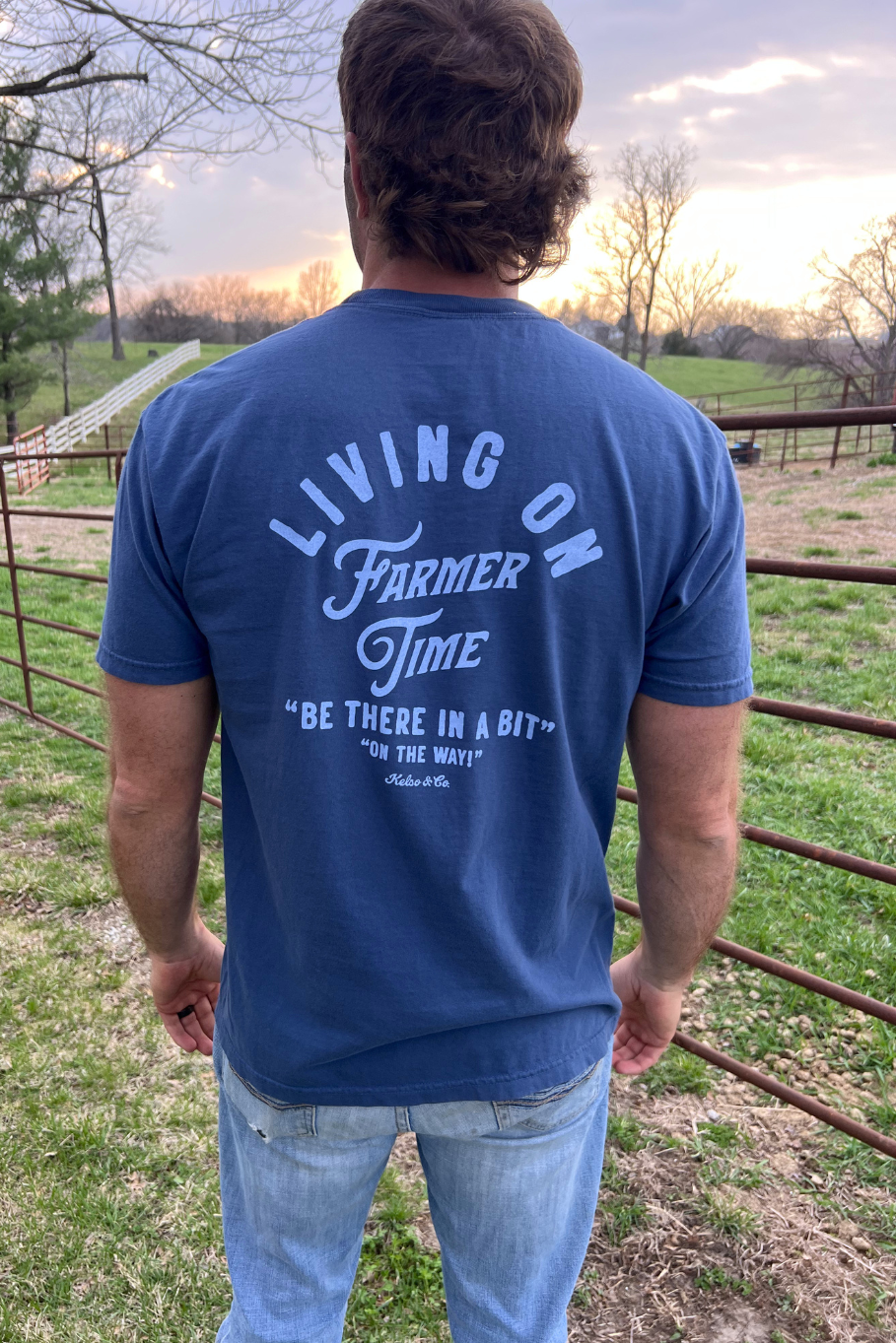 Living on farmer time unisex t shirt. Midnight blue shirt with light blue lettering.