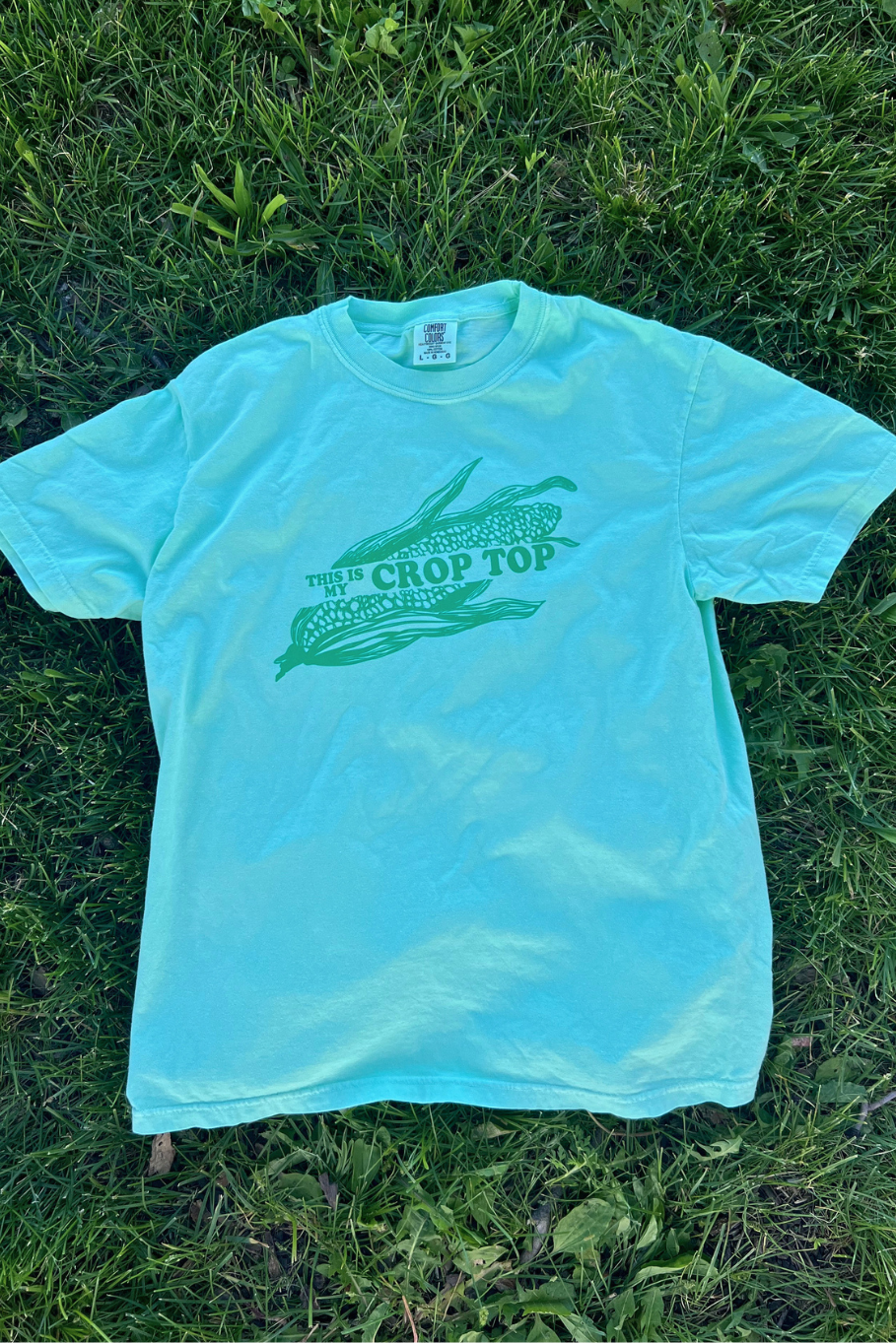 island reef comfort colors tshirt with green graphic ear of corn that says "this is my crop top"
