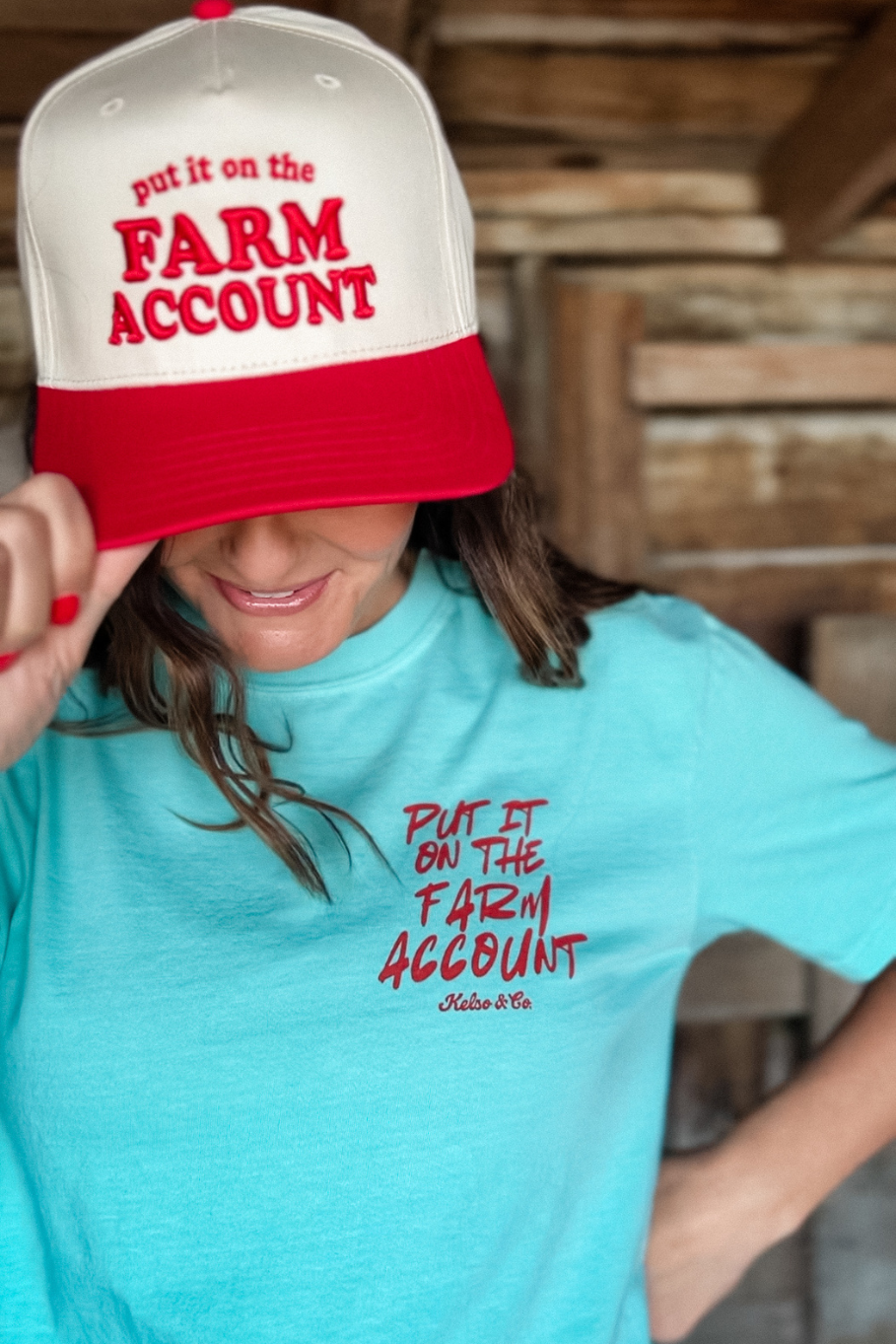 Put it on the farm account red trucker hat with farm account graphic tshirt