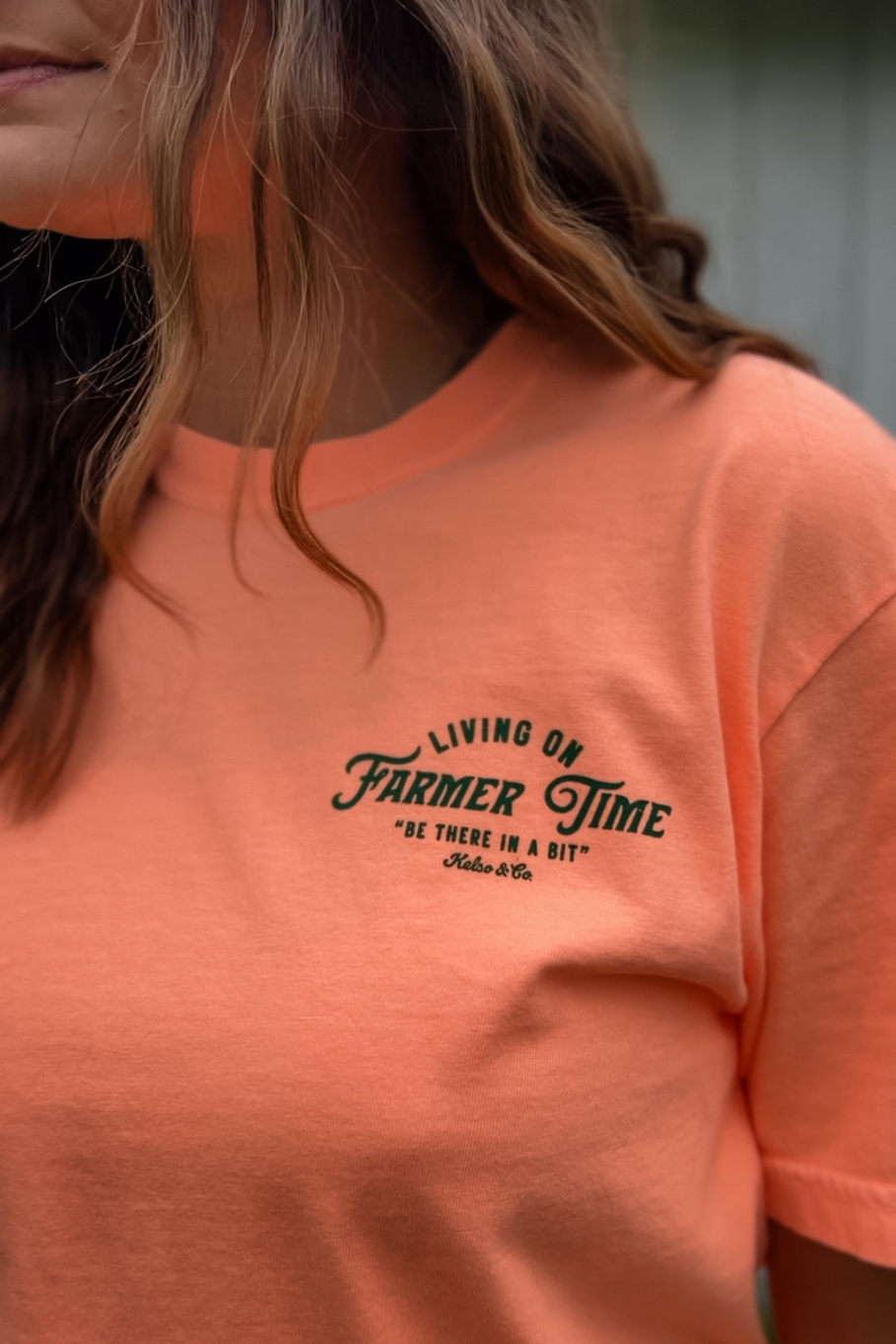front of living on farmer time graphic tshirt