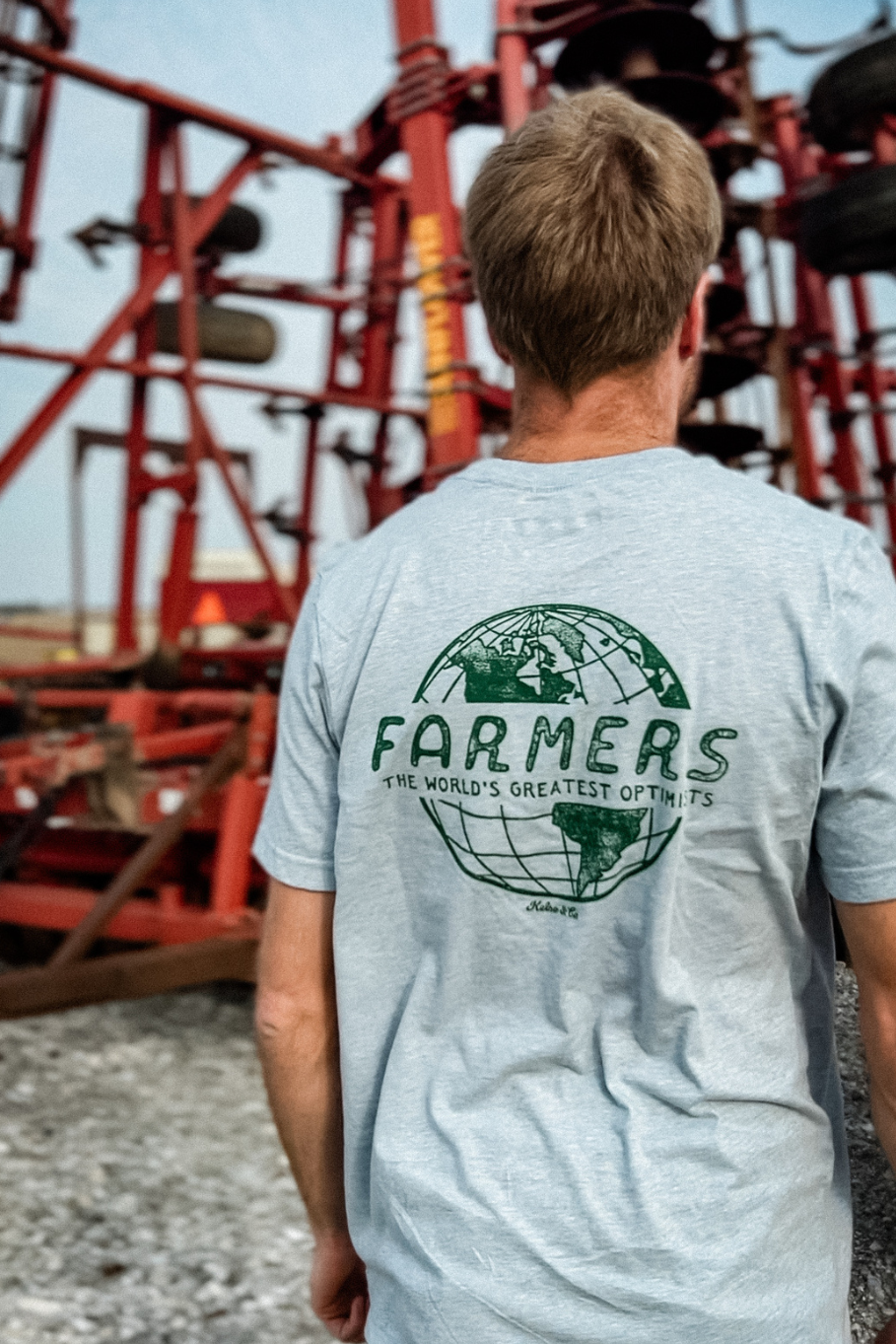 unisex farm graphic tshirt with &quot;farmers the world&#39;s greatest optimists&quot; on back