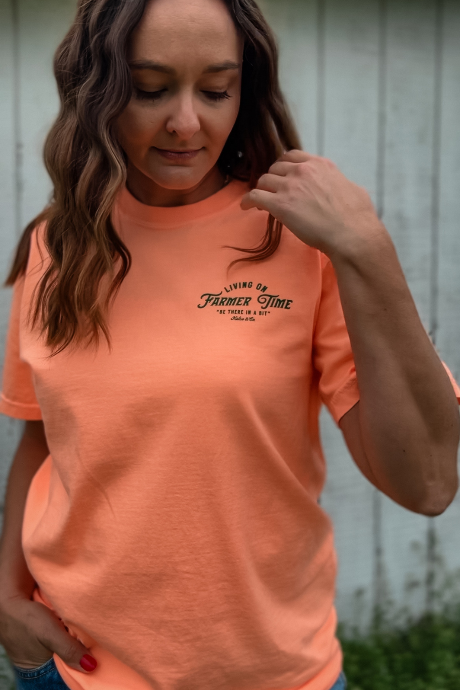 Living On Farmer Time Graphic Tee in Neon Cantaloupe