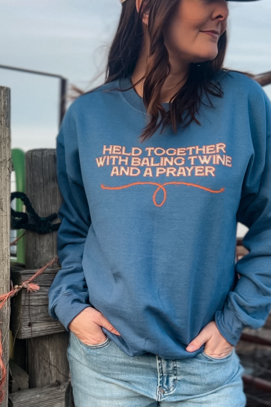 held together with baling twine and a prayer blue crewneck sweatshirt