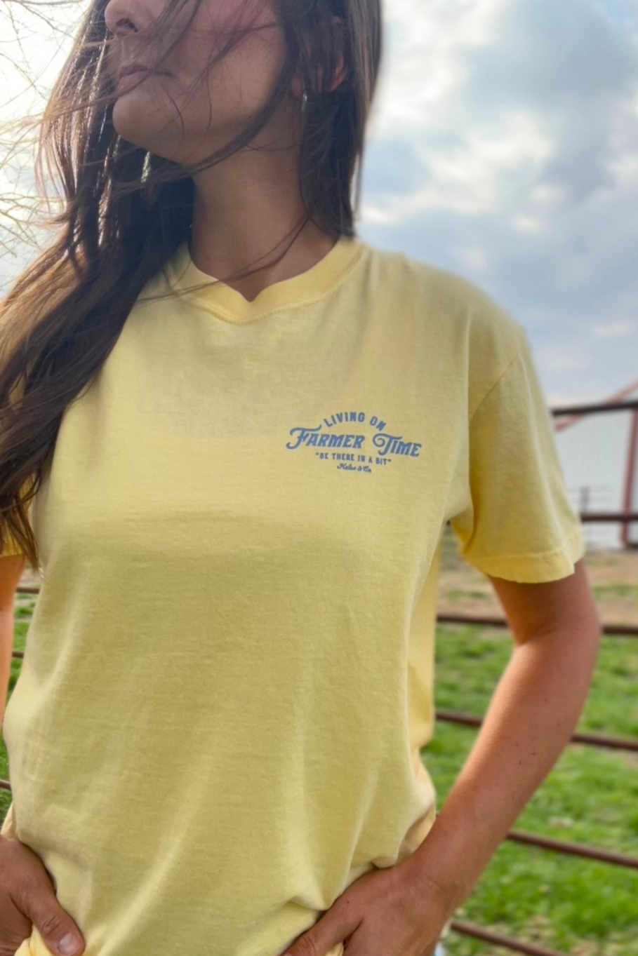 Butter yellow unisex t shirt with blue lettering. 
