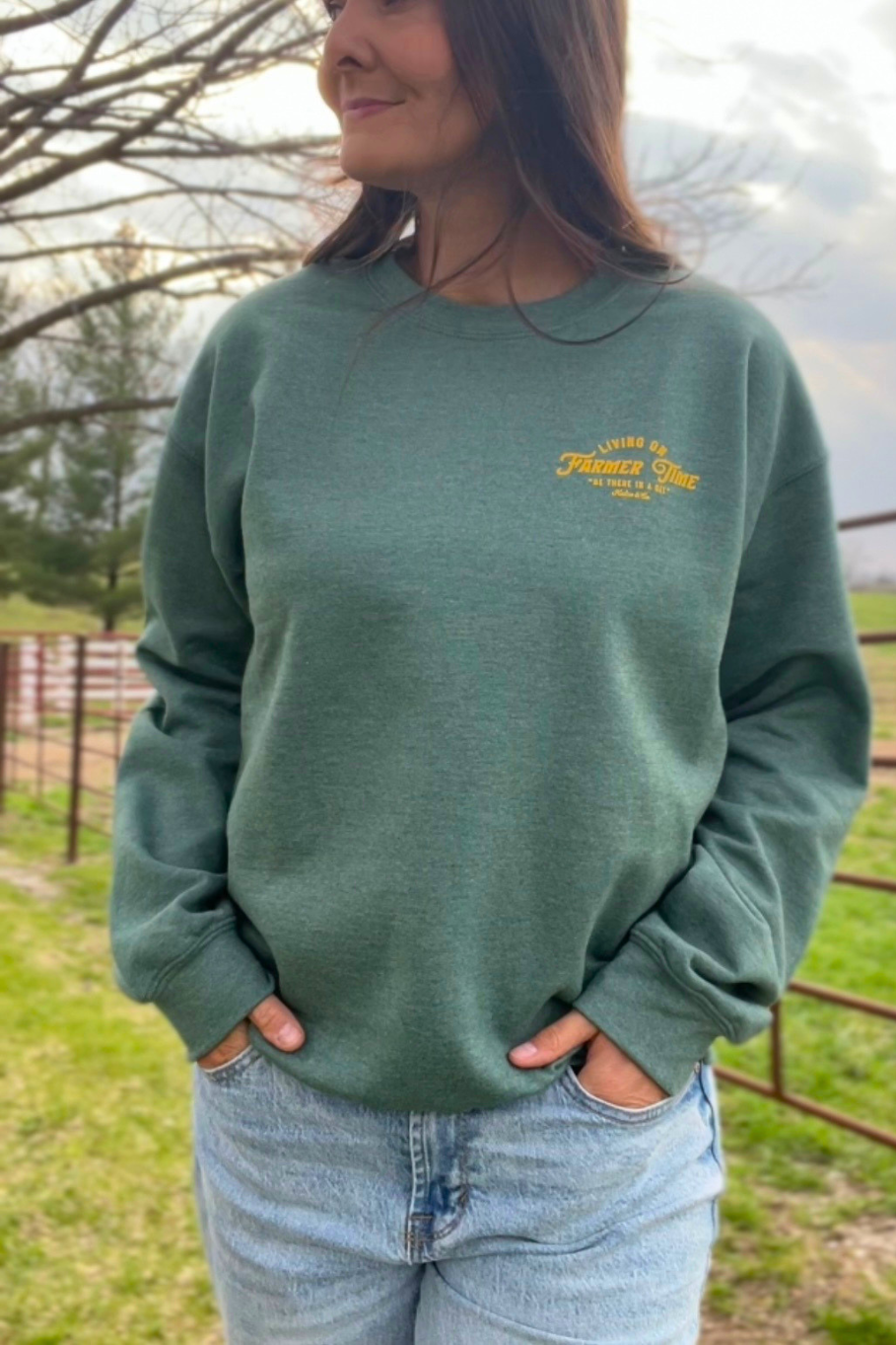 Green unisex sweatshirt with yellow lettering. 