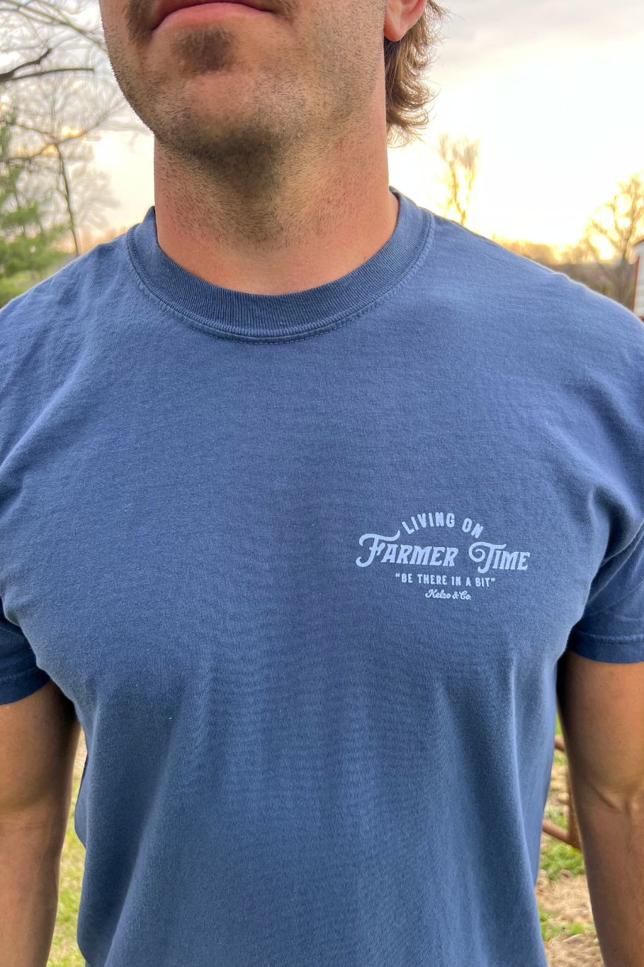Living on farmer time unisex t shirt. Midnight blue shirt with light blue lettering. 
