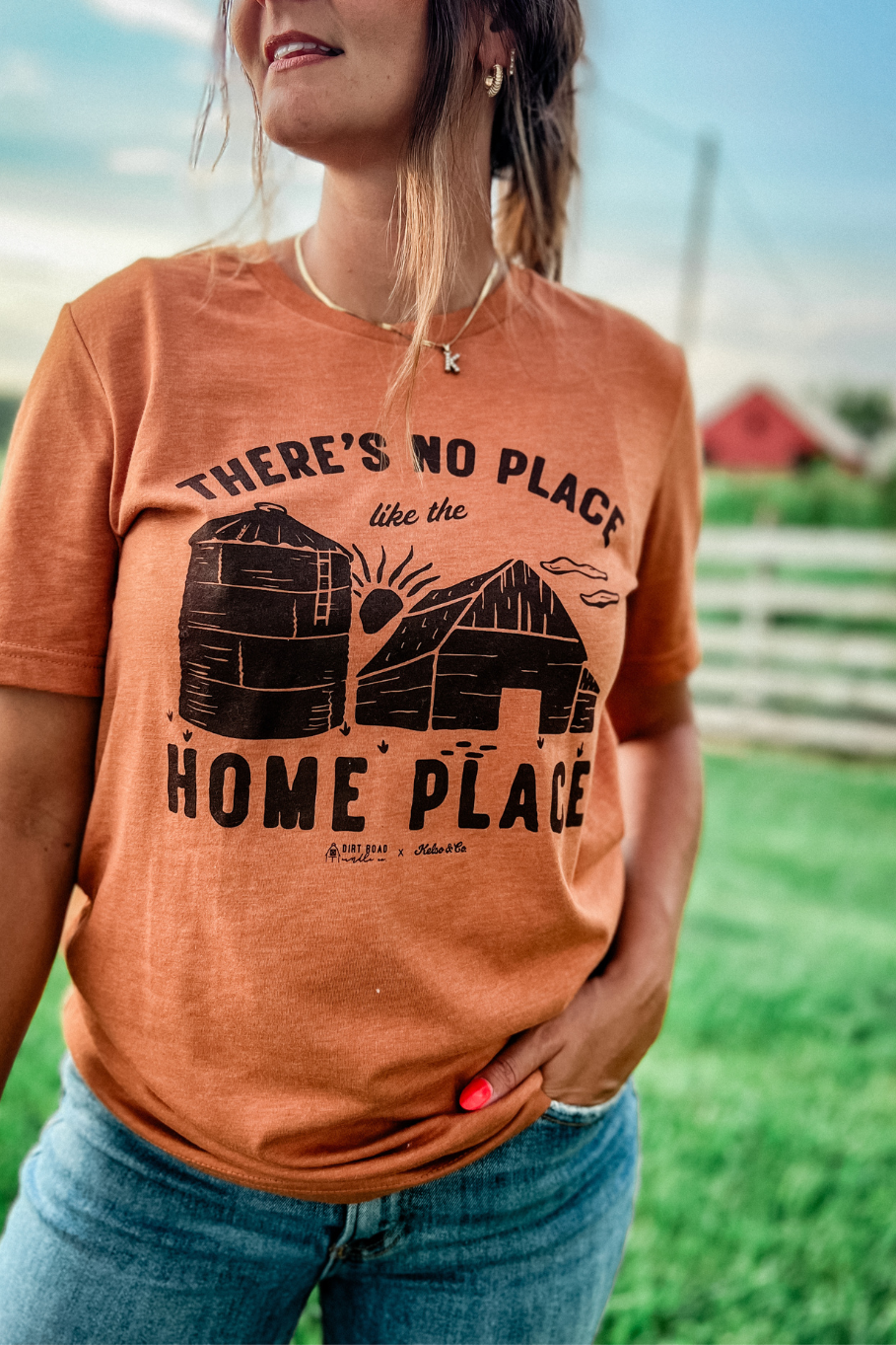 Tshirt of grain bin and barn that says "no place like the home place" 