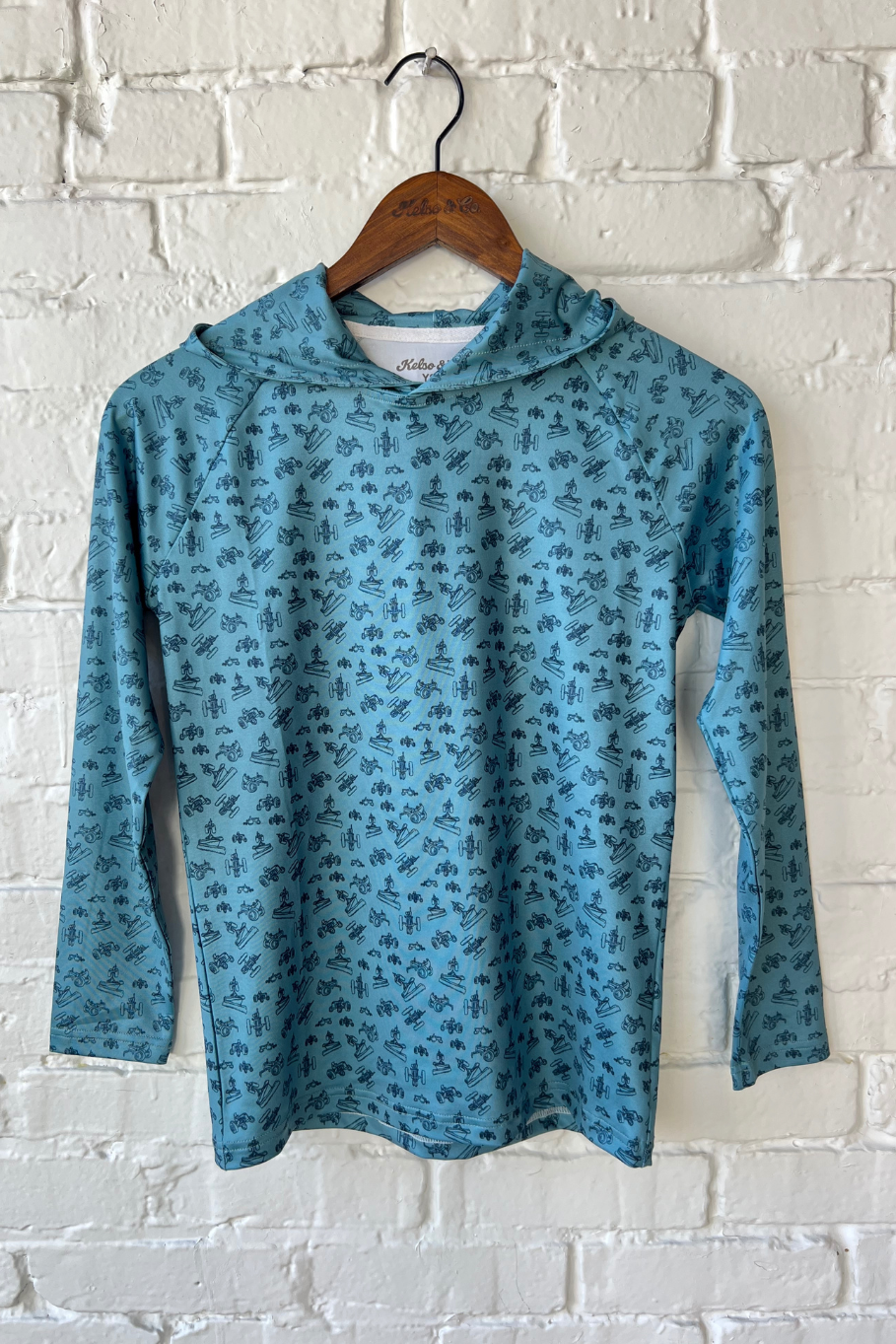 You performance hoodie in teal with all over farm icon print in blue. 