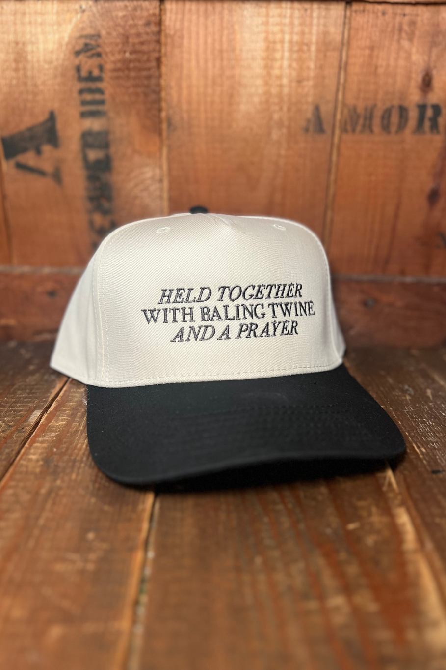 Trendy farm trucker hat with &quot;held together with baling twine and a prayer&quot;