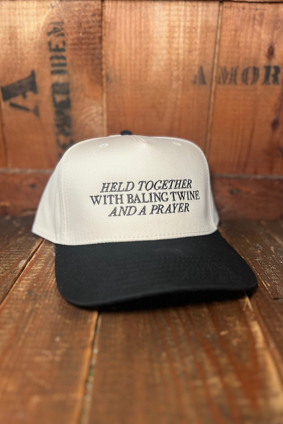 Trendy farm trucker hat with "held together with baling twine and a prayer"