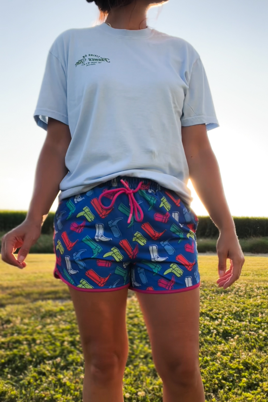 cowgirl print shorts in a retro style featuring neon colors