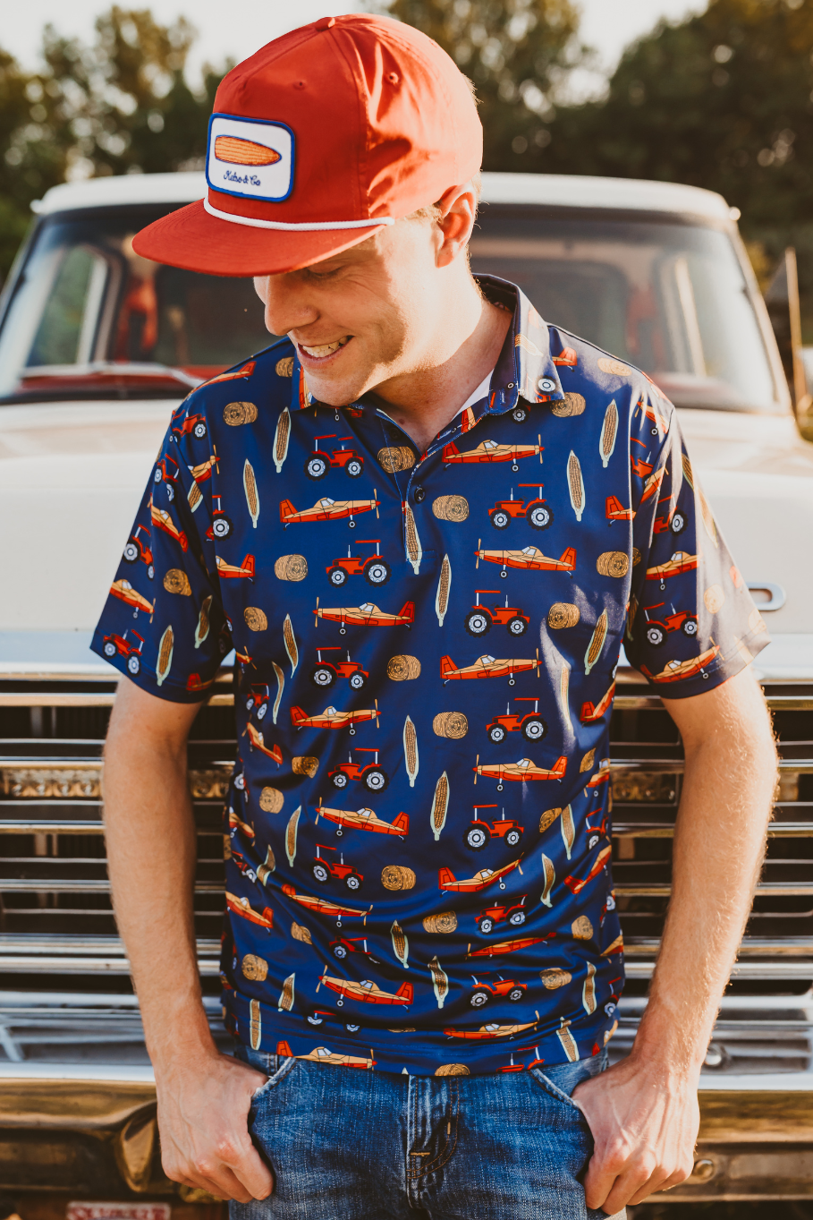 mens farm polo print with tractors, corn, crop duster plan and bale of hay