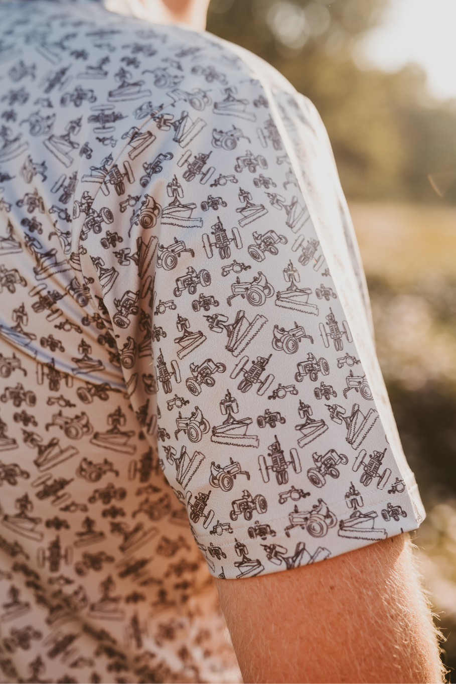 close up of the diesel drip antique tractor pattern men's polo