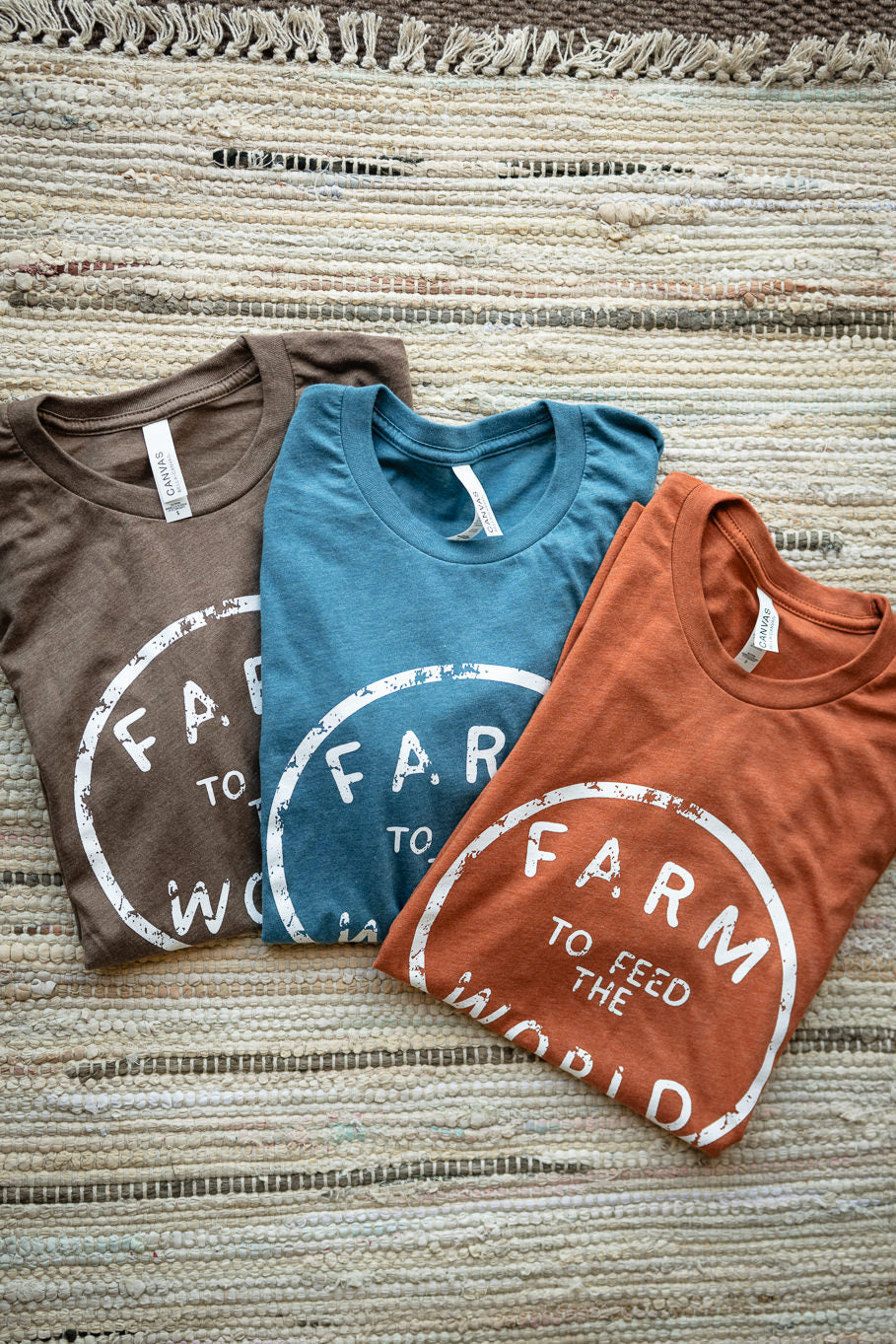 Feed the World Graphic Tee in Heather Brown | Sizes S - 3XL - Rosebud's Tees