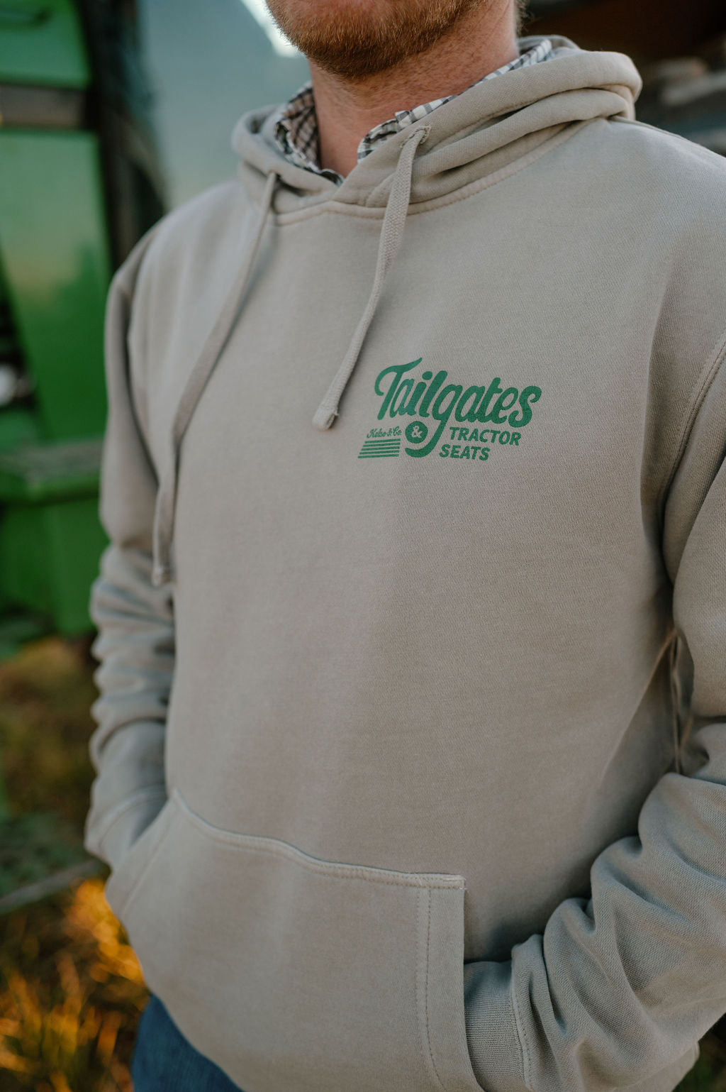 front of gray hoodie that says tailgates and tractor seats