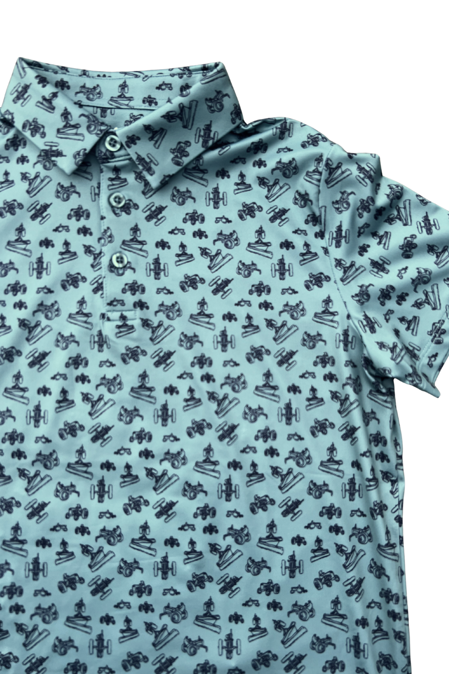 Close up picture of green kids polo with vintage tractor design