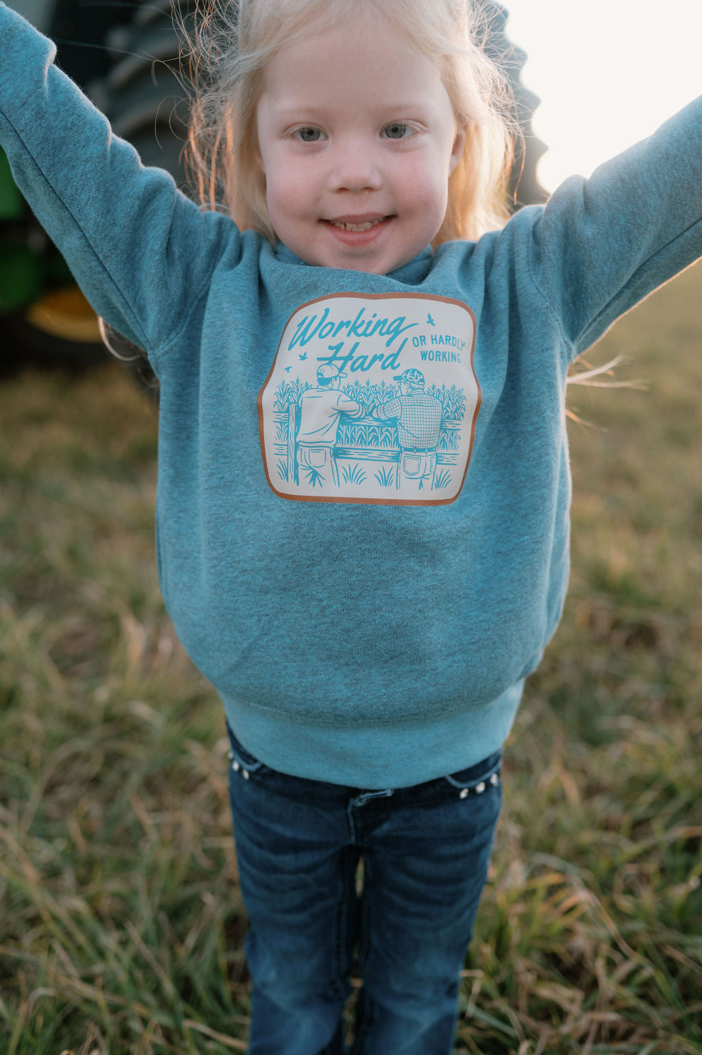 girl wearing blue hoodie working hard hardly working