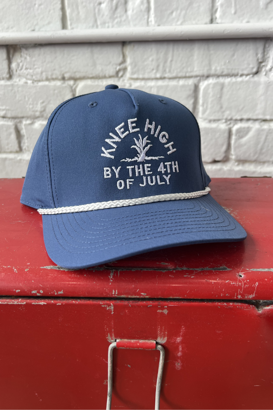 navy blue with white rope hat with white embroidery "knee high by the 4th of July"