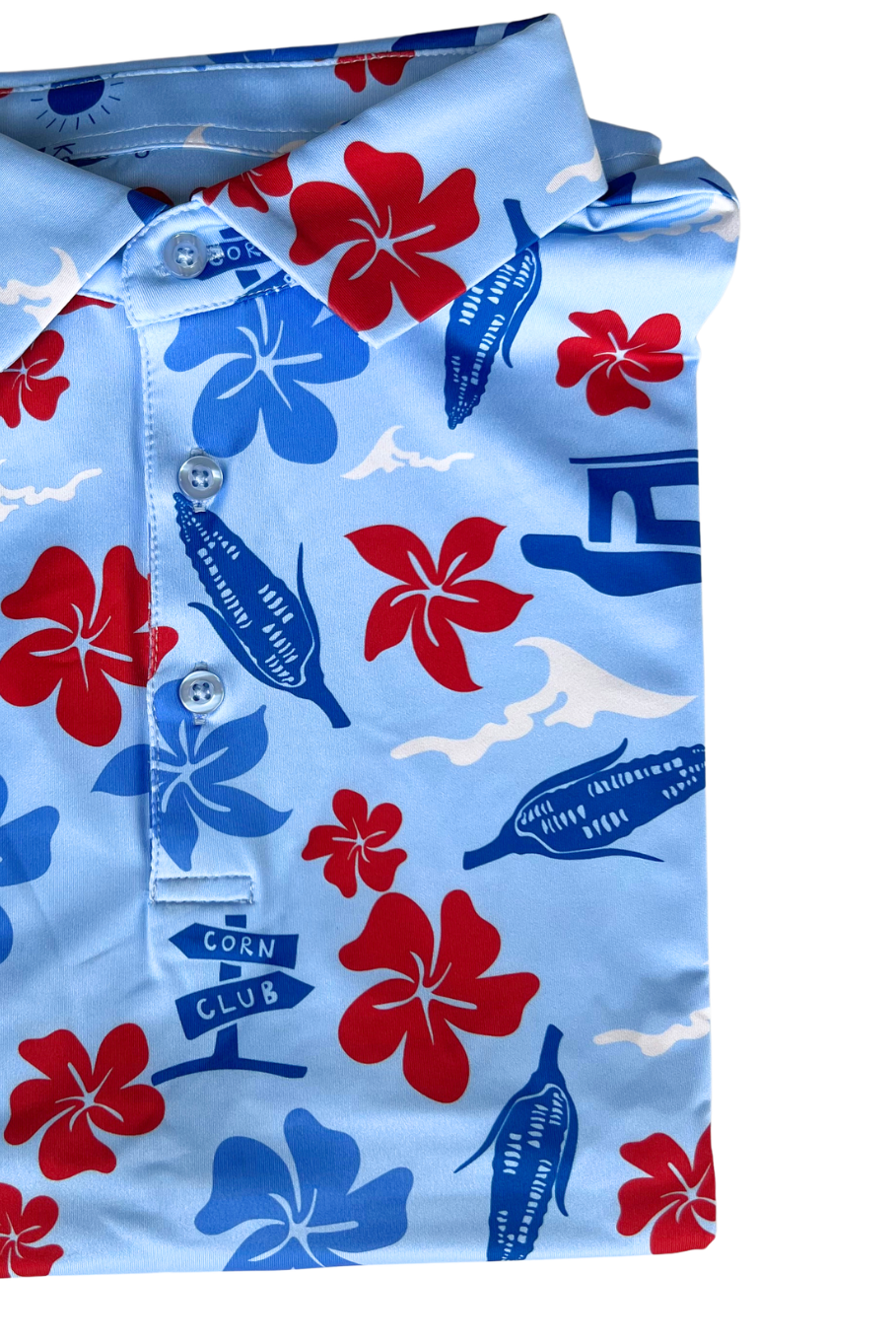 Detailed picture of a light blue polo with a red, white and blue Hawaiian inspired print.