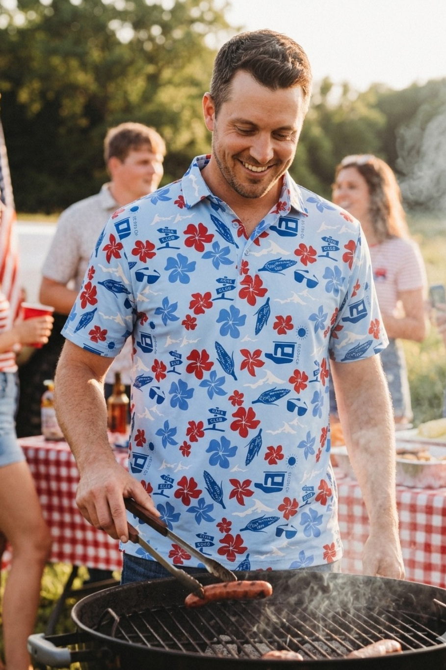 Man grilling outdoors at a casual outdoor event with a patriotic Hawaiian  like polo shirt