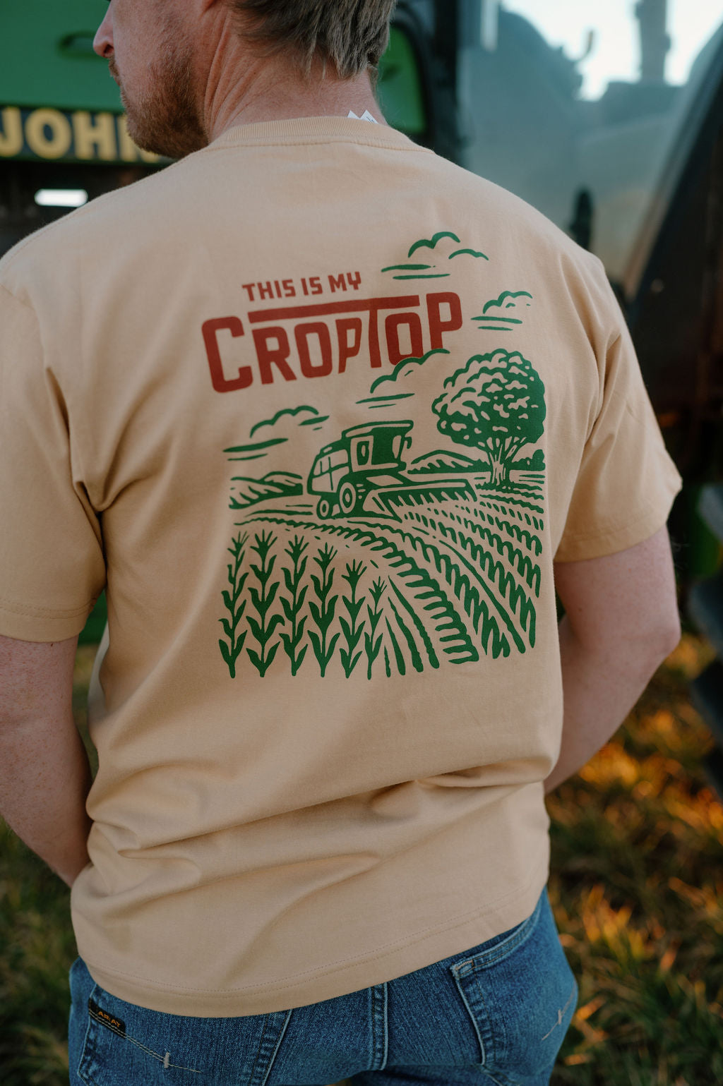 Back of camel graphic tshirt that says this is my crop top with a graphic of a combine harvesting corn