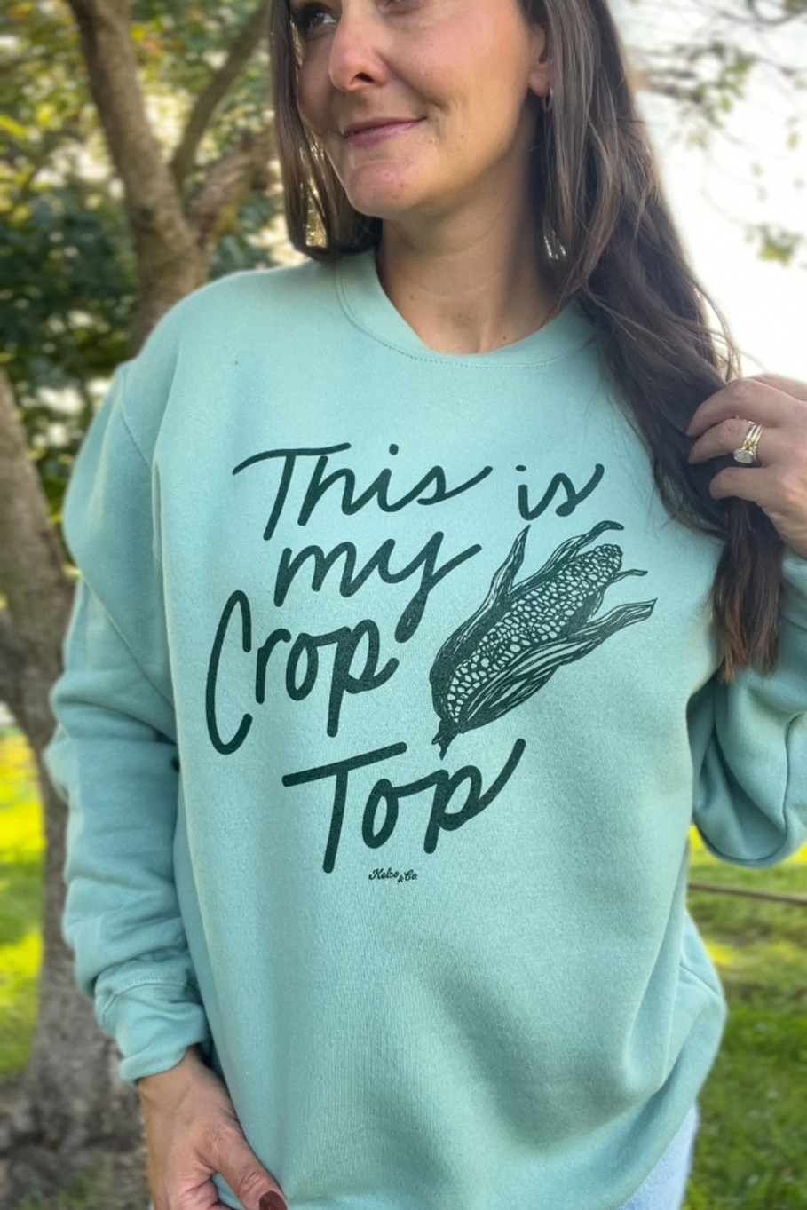 sage green sweatshirt with dark green graphic this is my crop top with ear of corn