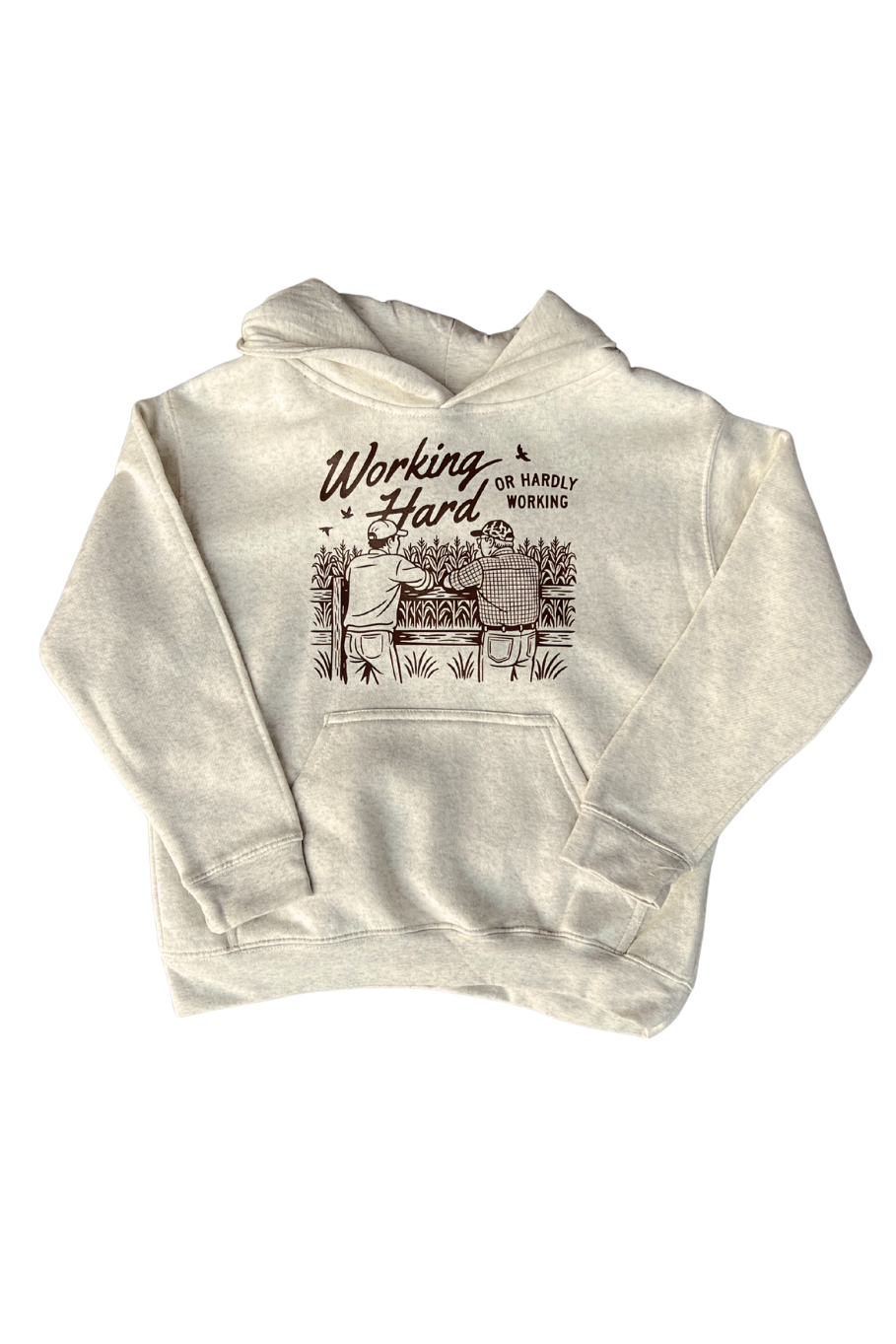 oatmeal youth hoodie with graphic of 2 farmers leaning up against a fence talking looking out over a cornfield with the works working hard or hardly working in brown