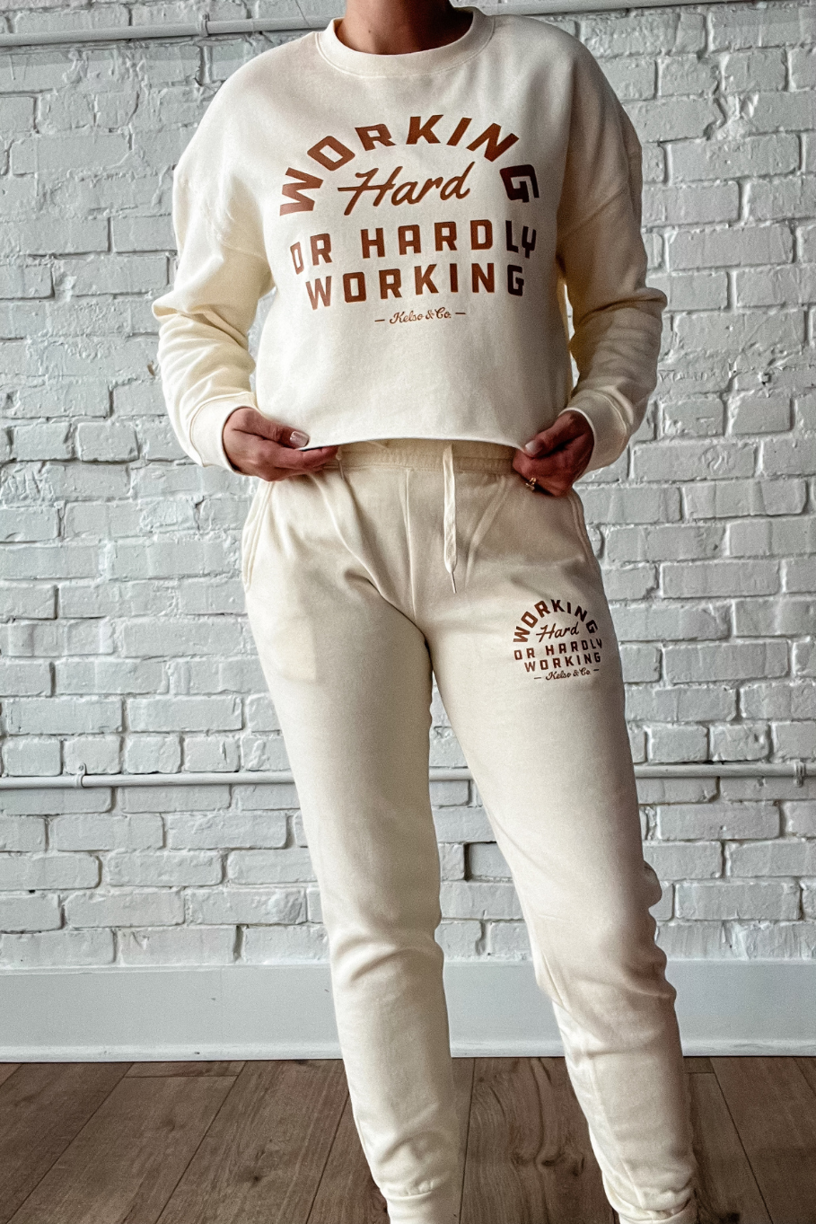 matching cropped crewneck and joggers for women - bone color with working hard or hardly working in brown